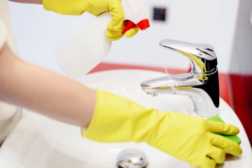 Technician treating fabric chairs during upholstery cleaning in Hammersmith