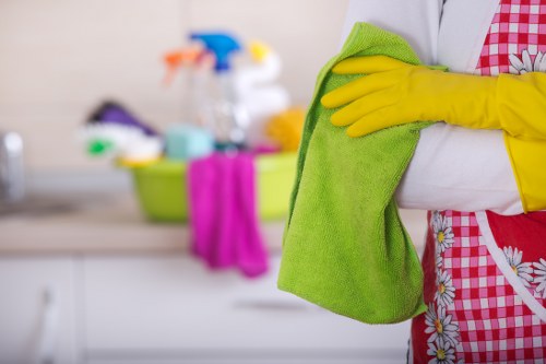Cleaner working through a move-out checklist in a Hammersmith property